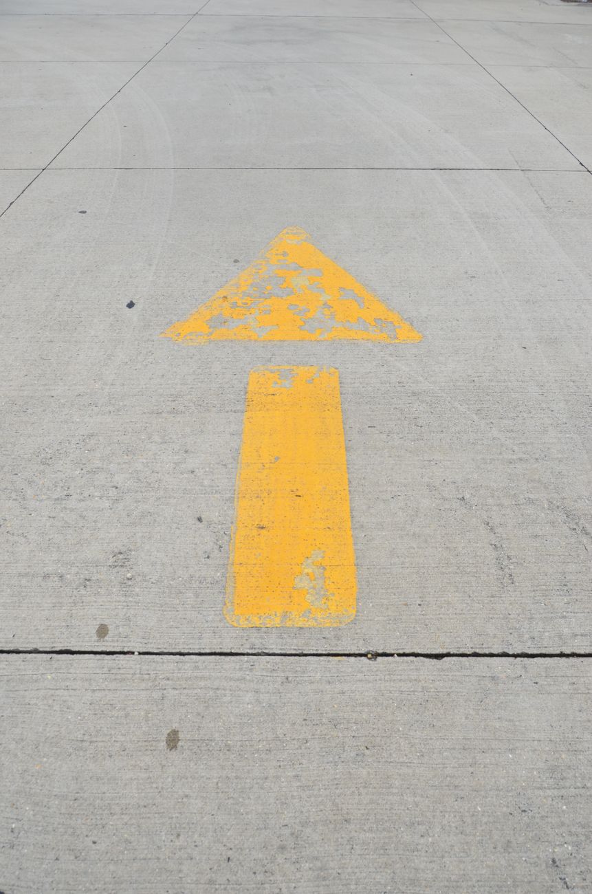 road sign on asphalt